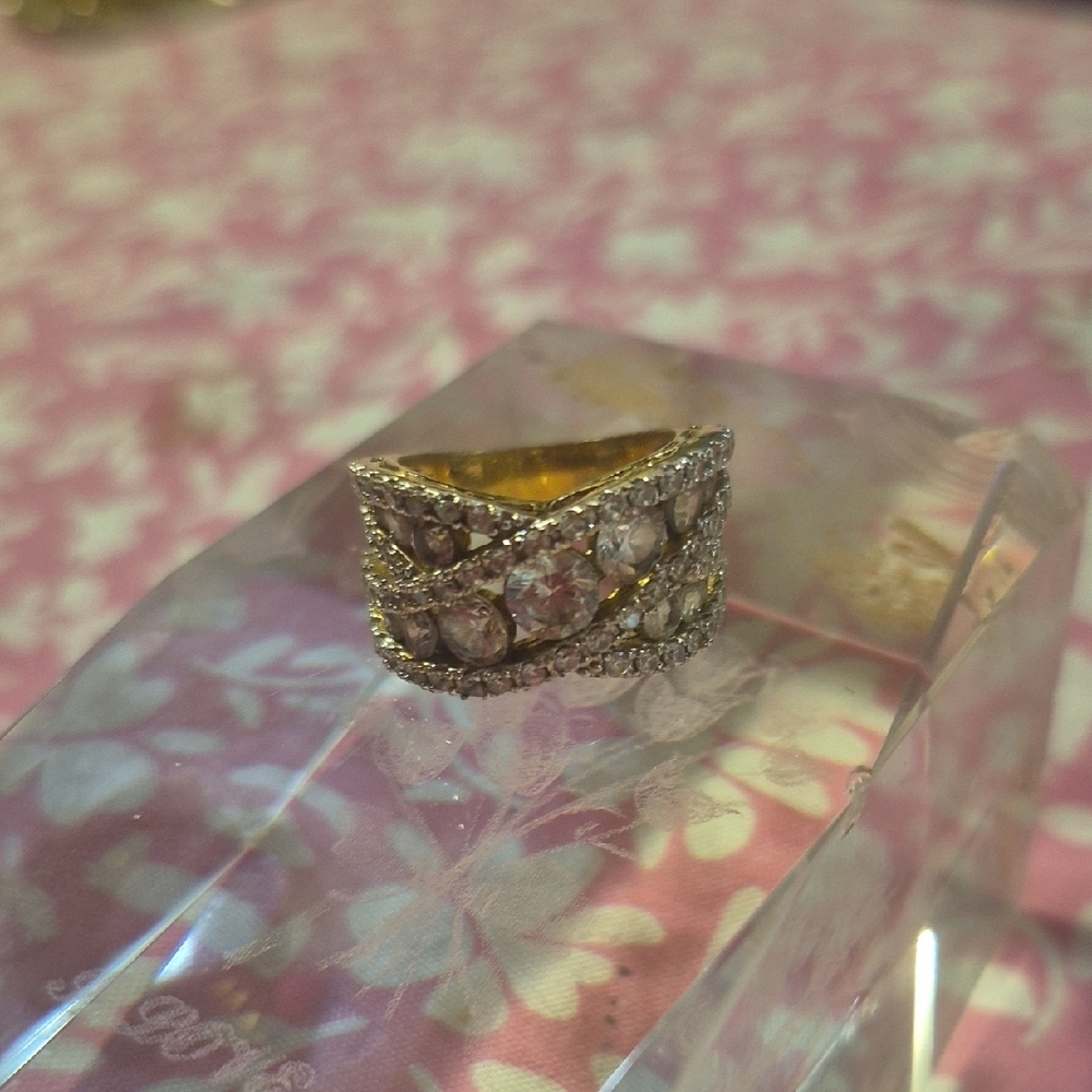 Ornate Gold Filigree Ring with Embedded Gems